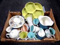 A box of miscellaneous Poole pottery dinner wares.
