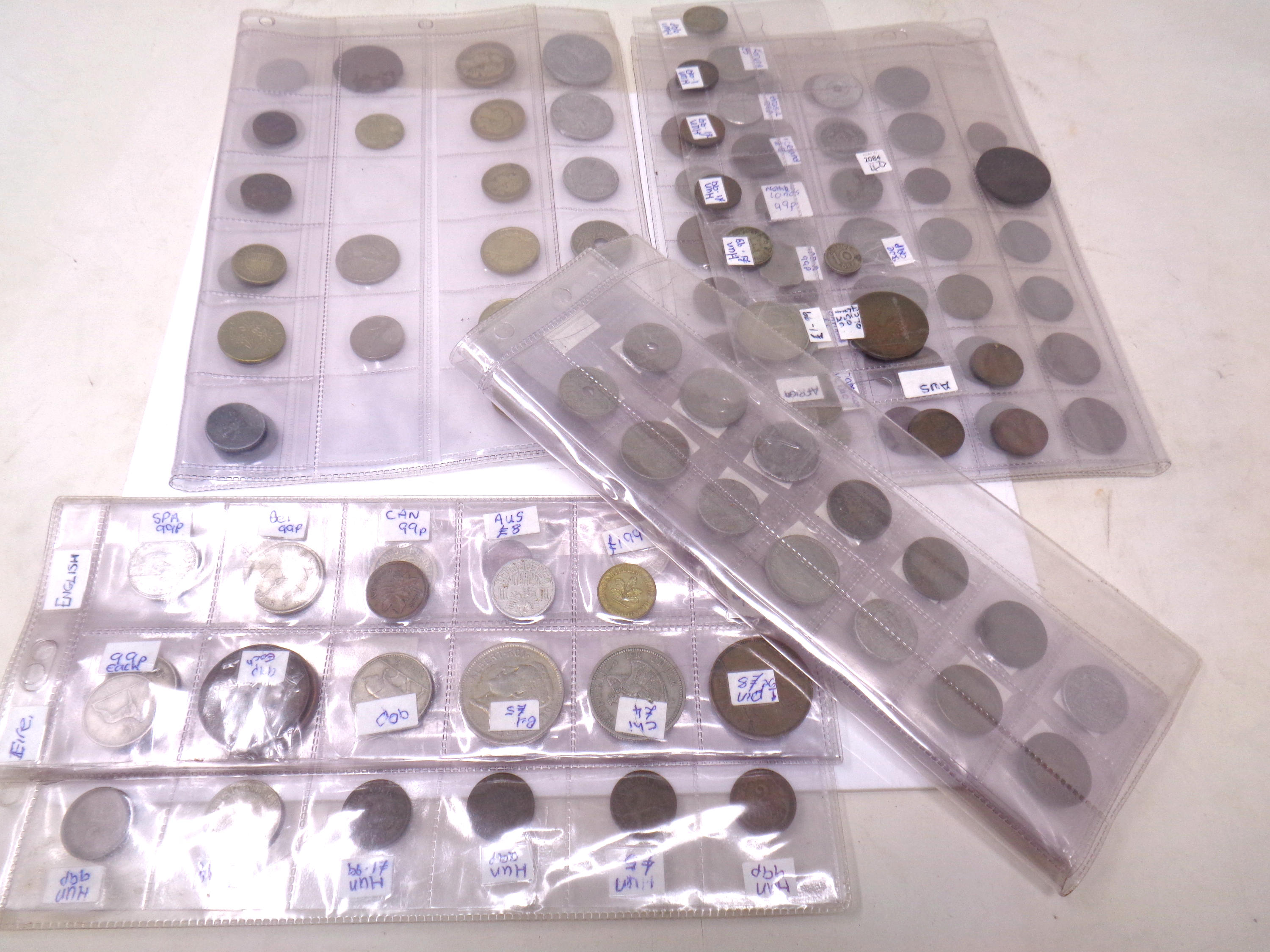 A box of various 20th century world coins.