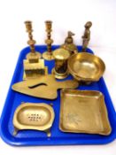 A tray containing antique and later brass ware including money boxes, a pair of candlesticks,