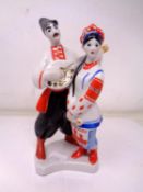 A USSR china figure of musicians (height 18cm).