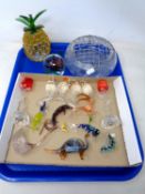 A tray containing glass ornaments including animal figures, a pair of stem roses,