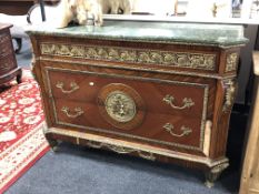 A Louis XV style three drawer chest with gilt metal handles and mounts and a green marble top