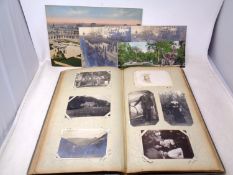 An album containing antique and later postcards including birthday,