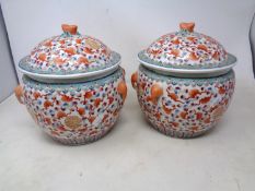 A pair of 20th century Chinese porcelain lidded pots.