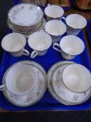 A tray containing eight Minton Jasmine china trios.