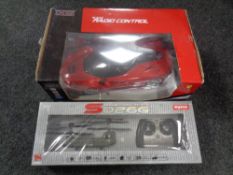 A Xstreet 1:12 scale remote controlled Ferrari together with a Syma SO26G remote control cargo