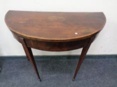 A 19th century inlaid mahogany D-shaped turn over top card table.