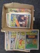 A box containing 1970s Roy of the Rovers comics.