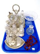 A tray containing three antique cut glass and silver plated cruet sets on stands together with a