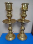 A pair of heavy brass Turkish candlesticks (height 64cm).