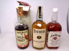 Three bottles of alcohol including Jim Beam Bourbon Whisky (1.