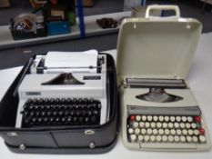 Two cased typewriters by Erika and Smith-Corona.