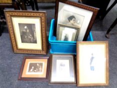 A box containing monochrome prints and photographs including Queen Victoria.