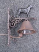 A cast iron black labrador wall bracket with bell.