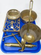 A tray containing antique and later brass ware including a trivet, anchor, ladle, two copper pans.