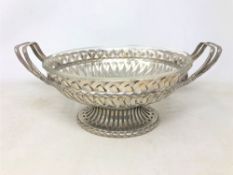 A late 19th century German 800 silver twin-handled bowl with glass liner,