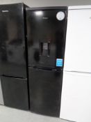 A Candy upright fridge-freezer with drinks dispenser (black).