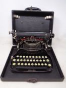 A vintage L C Smith & Corona typewriter in case.