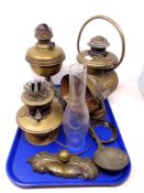 A tray containing antique metalware including oil lamps, a French lantern by G.