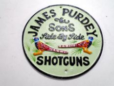 A cast iron wall plaque, James Purdy & Sons shotguns.