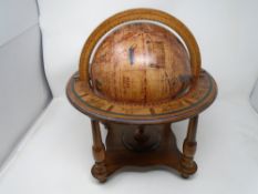 A desk globe on stand.