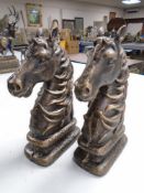 A pair of cast iron horse head bookends.