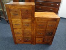 A mango wood six drawer chest and matching eight drawer chest.