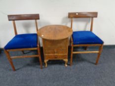 A pair of mid-20th century teak dining chairs together with a walnut sewing box fitted with two