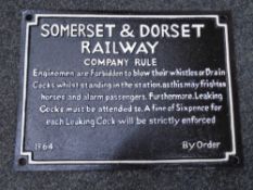 A cast iron wall plaque, Somerset and Dorset railway notice.