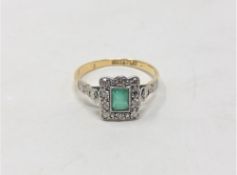 An 18ct yellow gold and platinum emerald and diamond ring, size J, 2.1g.