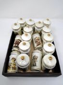 A box containing 17 Hummel lidded spice jars.