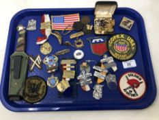 A tray of military and shooting badges, gilt cuff links, knife in sheath,