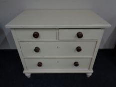 A painted pine two-over-two four drawer chest.