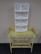 A rustic two tier painted lemonade stand together with a four tier whatnot stand.