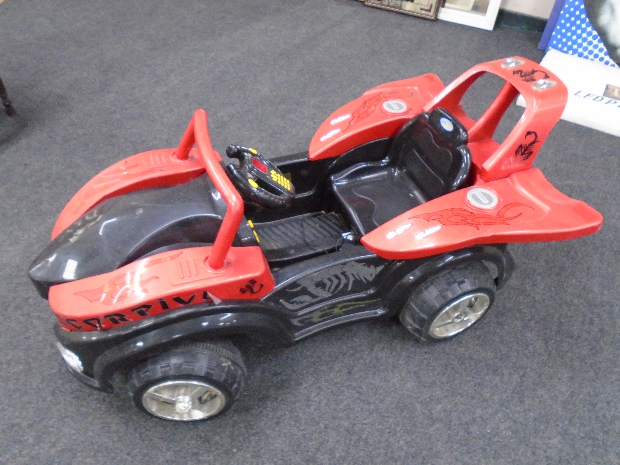 A child's electric ride-on car.
