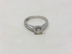 A platinum diamond solitaire ring, size F/G, with diamond grading report card, 0.