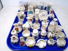 A tray containing a collection of Goss crested china together with two commemorative mugs.