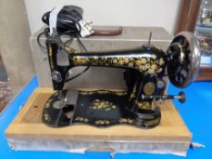 A Vintage Singer cased hand sewing machine (electrified).
