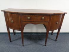 A 19th century inlaid mahogany double door bowfront sideboard fitted with central drawer on raised