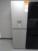 A Hotpoint upright fridge-freezer with water dispenser (silver).