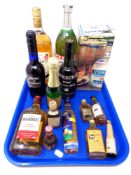 A tray containing assorted bottles of alcohol and alcohol miniatures including Ouzo, Bacardi,
