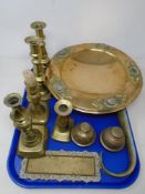 A tray containing antique and later metalware including candlesticks, shoehorn,