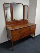A late Victorian inlaid mahogany two-over-one three drawer dressing chest with triple mirror on