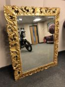 An antique style cushion mirror, with bevelled glass, 105 cm x 130 cm,