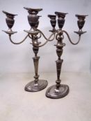 A pair of 19th century Old Sheffield Plate three-sconce table candelabra (height 43.5cm).