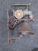 A cast iron traction engine wall bracket with bell.