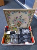 A box containing framed tapestry,
