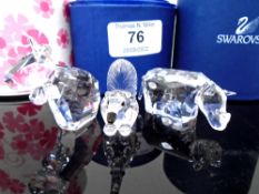 Three Swarovski crystal ornaments, cow, rhino and anteater.