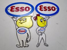 Two cast iron wall plaques, Esso, Andy and Abby slick.
