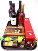 A tray containing assorted bottles of alcohol, wine and alcohol miniatures including Ouzo, Prosecco,